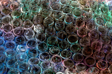 Absract background of shiny plastic and bubbles dreating bright sci-fi style texture background