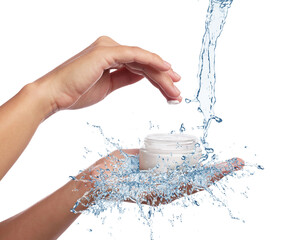 Woman holding jar of cosmetic product in water splashes on white background, closeup