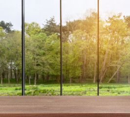 Empty wooden table against window in room