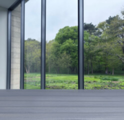 Empty wooden table against window in room