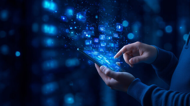 A person uses a smartphone to navigate through floating digital icons in a dark, high-tech setting. The vibrant blue lights create an immersive atmosphere, enhancing the digital experience