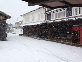 A traditional Japanese street in the historic Seki-juku post town during a heavy snowfall.