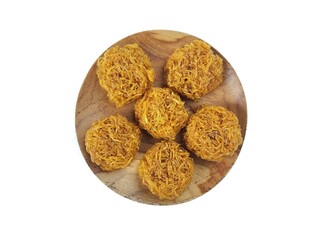 kremes snack on wooden plate or Indonesian snack made from sweet potatoes and palm sugar isolated white background.cookies on a white background