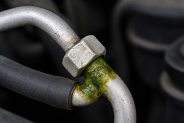 Naklejka premium Close-Up of Automotive AC Line with Freon Leak