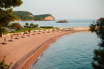 Serene Beach with Sun Loungers and Calm Sea