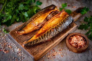 Smoked mackerel on a board. Smoked fish for lunch. Close-up