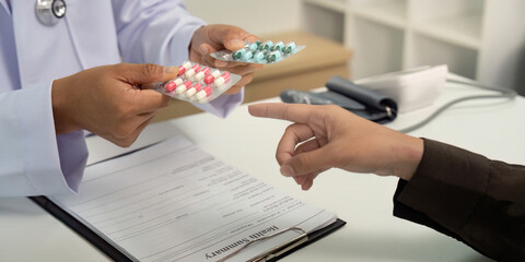 Medication Selection. Doctor presenting different medication options to patient.