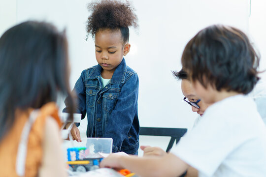 Young students enjoy learning a sciences in classroom. - Powered by Adobe