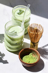 Iced Matcha Refreshment. Refreshing iced matcha drinks with a bamboo whisk and matcha powder