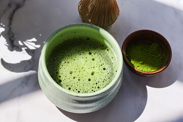 Matcha Tea Preparation. Ceremonial matcha bowl with whisk and matcha powder