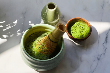 Ceremonial Matcha Setup. Traditional matcha tea set with powder, bamboo whisk