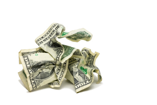 A Pile Of Crumpled One Dollar Bills