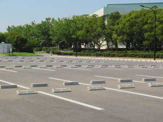 Lined parking blocks at the parking lot of the sports park.