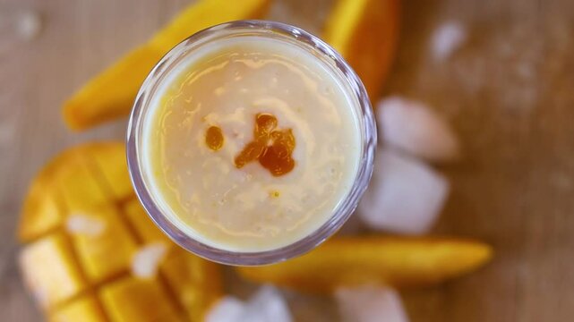 Mango lassi a cold indian refreshment drink made with curd and mango
