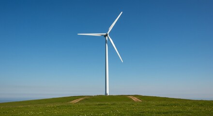 Majestic Wind Turbine on a Hilltop Meadow Under a Clear Sky