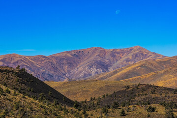 Moon rising over Craters Of The Moon National Monument and Preserve in Idaho