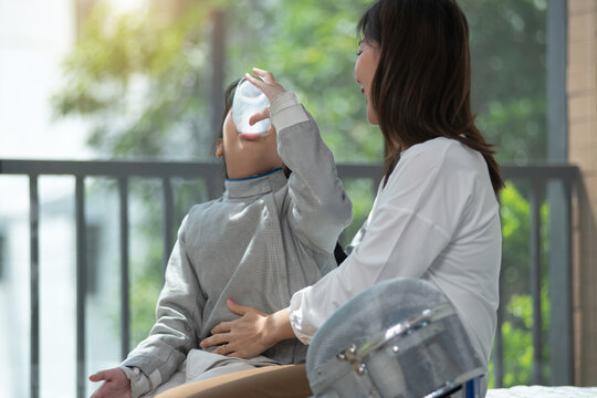 Fencing athlete, mother takes care of her daughter by giving her milk to drink, caring for growing child concept.