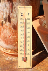 Climate change and global warming concept, outdoor thermometer displaying high temperatures, free copy space