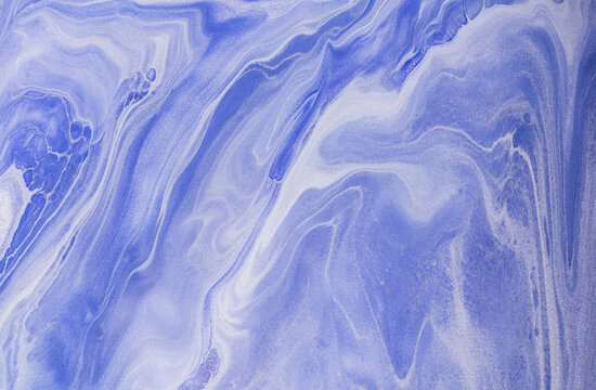 Abstract blue acrylic paint background with fluid patterns