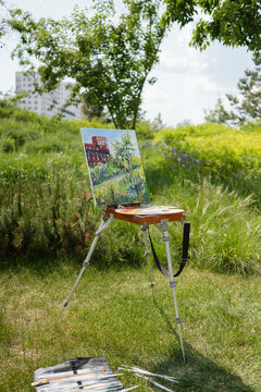 Plein air painting setup in sunny park