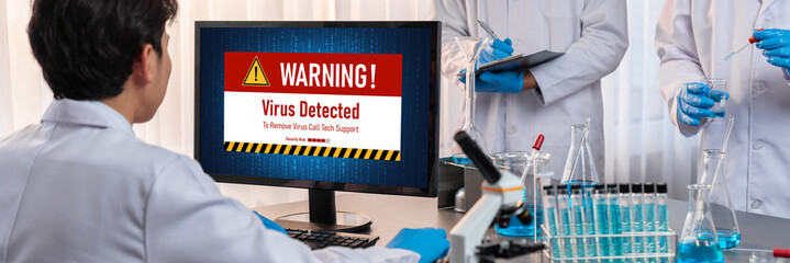 Virus warning alert on computer screen detected brisk cyber threat , hacker, computer virus and...