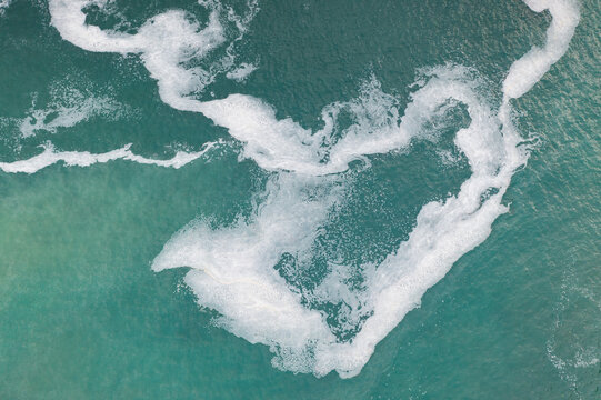 Aerial view of waves on the beach of silence in Asturias