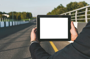 Businessman Holding Tablet with Blank Screen Roadside Technology