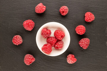 Sweet fresh raspberries, macro, top view.