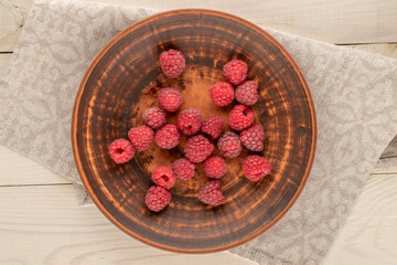 Sweet fresh raspberries, macro, top view.