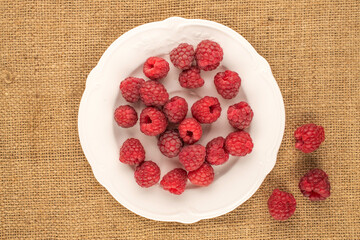 Sweet fresh raspberries, macro, top view.