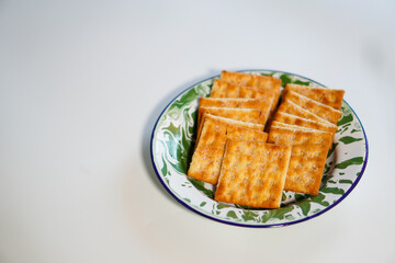 Light snack, a plate of cookies on a white background