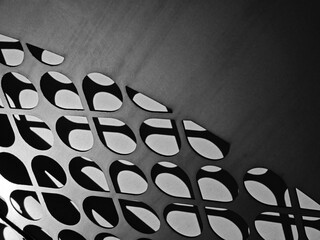 Perforated metallic arc shaped abstract texture