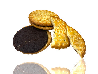 Golden chocolate cookies artistically arranged on the white background