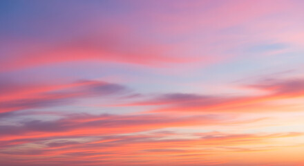 Fototapeta premium Colorful sunset sky with vibrant pink, orange, and purple clouds creating a beautiful and serene atmosphere.