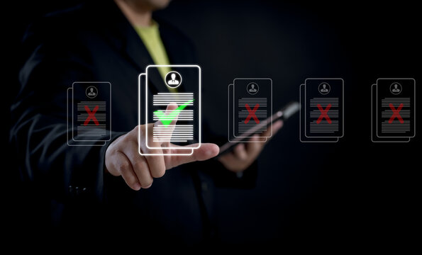 Businessman using digital interface to select candidate profile with green check mark among rejected resumes, symbolizing modern recruitment, hiring decision, and job application screening.