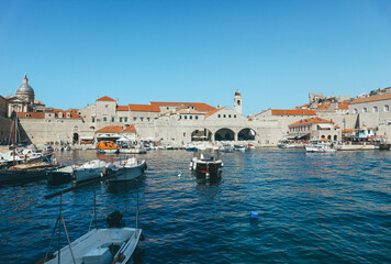dubrovnik old town sea port with orange roof buildings and blue sea