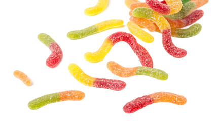 Falling sour gummy worms isolated on a white background PNG. AI GENERATED.