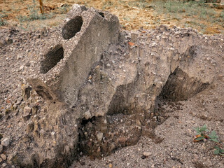concrete block that sank among the long-dried sand mountains