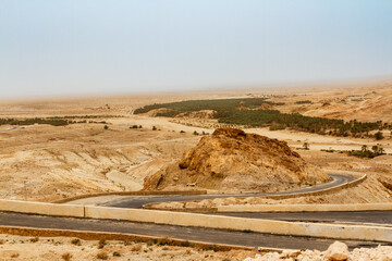 A winding paved road in the mountains. Djebel en Negueb. Chebika Oasis, Tunisia
