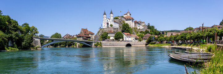 Obraz premium Aarburg city on the river Aare with church, fortress and boats panorama in Switzerland