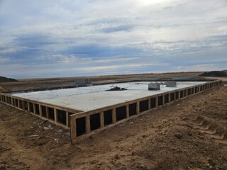 Fresh Concrete Slab Foundation on Open Construction Site