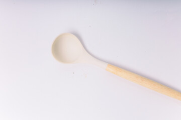 White silicone kitchen soup ladle isolated on white background. Kitchen utensils