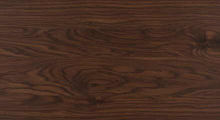 Fototapeta premium Closeup of rich dark brown wooden surface showing natural grain patterns and visible knots