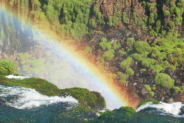 Spectacular Rainbow Spreading over the Iguacu Falls at Brazilian Side, Foz do Iguacu, Brazil, South...