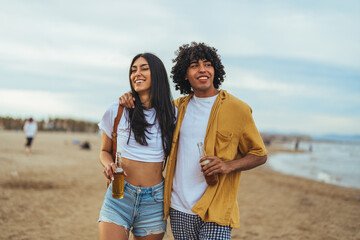 Joyful Friends Enjoying Summer Day On Beach With Refreshing Drinks