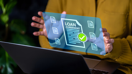 Person reviewing a digital loan agreement document with a checkmark on a futuristic screen