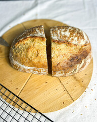 Homemade bread loaf without yeast or gluten in woman hands. Image for health conscious audiences...