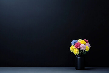 Colorful flowers arranged in a geometric planter on a dark background