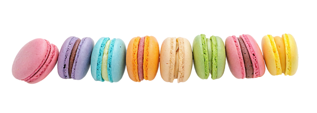 Colorful assorted macarons lined up in a row showcasing different flavors and vibrant pastel colors