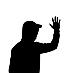 Silhouette of a Man Wearing a Cap Raising His Hand in a Waving Gesture